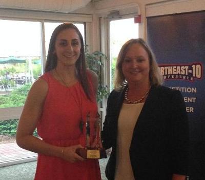 Lauren Battista receives one of her awards from NE-10 Commissioner Julie Ruppert