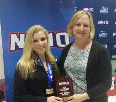Nicola Mancini accepts the Women's Diver of the Meet Award from NE-10 Commissioner Julie Ruppert