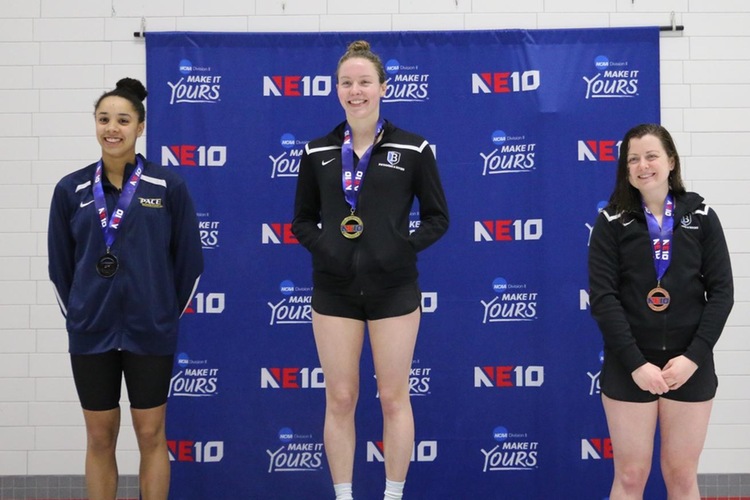 Kate Kaduboski at the top of the 400 IM podium with teammate Emily Niemiec on the right.
