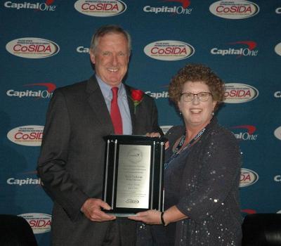 Terry Carleton received his Academic All-America Hall of Fame award from CoSIDA President Shelley Poe