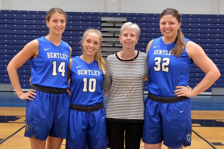 From left, Megan Lewis, Amy McConnell, Coach Stevens, Victoria Lux