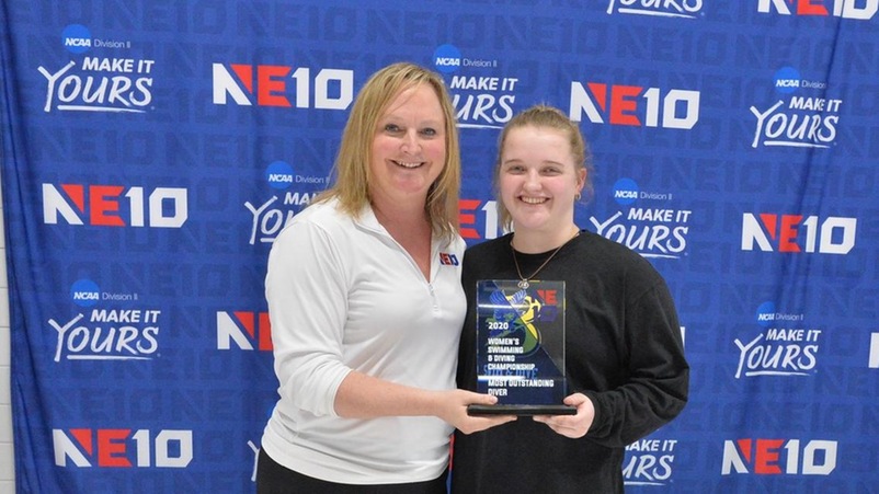 Mary Huminski receives the Most Outstanding Diver Award from NE10 Commissioner Julie Ruppert
